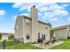 Exterior of the house, featuring a backyard with patio, outdoor furniture, and a well-kept lawn at 3811 Tartan Trl, Whitestown, IN 46075
