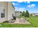 Spacious backyard with a concrete patio, outdoor furniture, and lush green grass at 3811 Tartan Trl, Whitestown, IN 46075