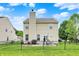 Spacious backyard featuring a patio with grill, and a well-maintained lawn, perfect for outdoor entertaining at 3811 Tartan Trl, Whitestown, IN 46075
