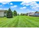 Wide backyard space with manicured lawn and view of neighboring properties at 3811 Tartan Trl, Whitestown, IN 46075