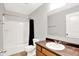 Well-lit bathroom featuring a vanity, toilet, and shower with curtain at 3811 Tartan Trl, Whitestown, IN 46075