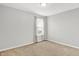 Neutral bedroom featuring a window offering outside views and neutral carpeting at 3811 Tartan Trl, Whitestown, IN 46075