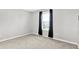 Simple and well-lit bedroom with neutral carpet, window and dark curtains at 3811 Tartan Trl, Whitestown, IN 46075