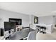 Well-lit bonus room with a home office setup, television, and exercise equipment at 3811 Tartan Trl, Whitestown, IN 46075
