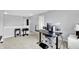 Open loft area with grey walls, carpeted floor, and space for a home office and exercise equipment at 3811 Tartan Trl, Whitestown, IN 46075
