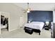 Inviting main bedroom featuring a tray ceiling, en-suite bathroom, and walk-in closet at 3811 Tartan Trl, Whitestown, IN 46075