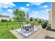 Outdoor patio featuring a dining set, grill, and lush green lawn at 3811 Tartan Trl, Whitestown, IN 46075