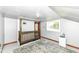 Finished attic room featuring vintage railing and a large area rug at 402 E 4Th St, Sheridan, IN 46069