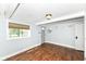 Finished bedroom featuring wood floors, a window, and a classic ceiling fan at 402 E 4Th St, Sheridan, IN 46069