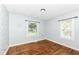 Simple bedroom with hardwood floors and windows for natural light at 402 E 4Th St, Sheridan, IN 46069
