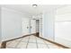 Neutral bedroom with white rug, light blue walls and doors leading to closet space at 402 E 4Th St, Sheridan, IN 46069