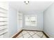 A bright bedroom boasts built-in shelves, a neutral palette, and a plush area rug at 402 E 4Th St, Sheridan, IN 46069