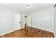Charming bedroom featuring hardwood floors, light blue walls, and decorative wallpaper at 402 E 4Th St, Sheridan, IN 46069