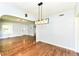 Inviting dining area with hardwood floors and a modern light fixture at 402 E 4Th St, Sheridan, IN 46069