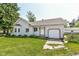 Charming single Gathering home featuring a well-maintained lawn, small garage and beautiful bay window at 402 E 4Th St, Sheridan, IN 46069