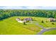 Expansive estate features a circular drive, detached garage, and mature landscaping at 4181 Whitetail Woods Dr, Bargersville, IN 46106