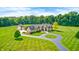 Expansive estate features a circular drive, detached garage, and mature landscaping at 4181 Whitetail Woods Dr, Bargersville, IN 46106