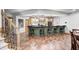 Basement bar with chairs, countertop, storage cabinets, and tile flooring at 4181 Whitetail Woods Dr, Bargersville, IN 46106