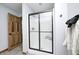 Bathroom featuring tiled floors, a dark wood door, and shower with sliding glass doors at 4181 Whitetail Woods Dr, Bargersville, IN 46106