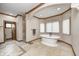Bright bathroom featuring a freestanding tub, tile flooring, and a doorway to the shower at 4181 Whitetail Woods Dr, Bargersville, IN 46106