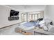 Well-lit primary bedroom showcases a unique bed with a built-in entertainment system and natural light at 4181 Whitetail Woods Dr, Bargersville, IN 46106