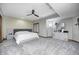 Primary bedroom featuring a tray ceiling, modern furniture, carpet, and a ceiling fan at 4181 Whitetail Woods Dr, Bargersville, IN 46106