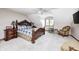 Bedroom features a decorative wood bedframe, ceiling fan, and charming window seat at 4181 Whitetail Woods Dr, Bargersville, IN 46106