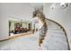 Elegant formal dining room with a large table, chairs, and staircase at 4181 Whitetail Woods Dr, Bargersville, IN 46106