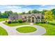 Charming two-story stone home features a circular drive, lush lawn and beautiful, mature landscaping at 4181 Whitetail Woods Dr, Bargersville, IN 46106