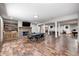 Spacious game room with a fireplace, flat screen tv, poker table, pool table, ping pong table, and foosball table at 4181 Whitetail Woods Dr, Bargersville, IN 46106
