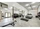 Spacious garage with concrete floors, white walls, exercise equipment, and garage doors at 4181 Whitetail Woods Dr, Bargersville, IN 46106