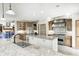 This gourmet kitchen includes granite countertops, a center island with sink, custom cabinets, and stainless appliances at 4181 Whitetail Woods Dr, Bargersville, IN 46106