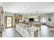 Gourmet kitchen featuring granite countertops, a center island with sink, and stainless steel appliances at 4181 Whitetail Woods Dr, Bargersville, IN 46106