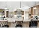 The kitchen features granite counters, custom cabinets, stainless hood, backsplash and eat-in bar at 4181 Whitetail Woods Dr, Bargersville, IN 46106