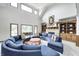Bright living room boasts a cozy fireplace, built-in bookshelves, and abundant natural light at 4181 Whitetail Woods Dr, Bargersville, IN 46106