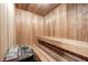 Wood-paneled sauna with wooden bench and heater at 4181 Whitetail Woods Dr, Bargersville, IN 46106