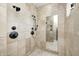 Tiled shower with dual shower heads and inset shampoo shelves at 4181 Whitetail Woods Dr, Bargersville, IN 46106