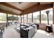 Inviting screened-in porch with comfortable seating, ceiling fan, and views of the home's exterior and landscape at 4181 Whitetail Woods Dr, Bargersville, IN 46106