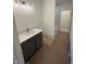 Bathroom with gray vanity, white countertop and silver fixtures at 4295 Hamilton Run, Zionsville, IN 46077