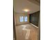 Bedroom featuring dark green wainscoting, unfinished floors and a double window at 4295 Hamilton Run, Zionsville, IN 46077