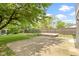 Spacious backyard with a concrete patio, deck, and wooden fence, ideal for relaxation and entertaining at 4718 Dancer Dr, Indianapolis, IN 46237