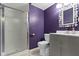 A full bathroom features a glass-enclosed shower and a gray vanity at 4718 Dancer Dr, Indianapolis, IN 46237