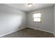 Bedroom with neutral walls and carpet has a window that lets in natural light at 4718 Dancer Dr, Indianapolis, IN 46237