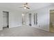 This bedroom has ample closet space, neutral walls, a ceiling fan, and a connected bathroom at 4718 Dancer Dr, Indianapolis, IN 46237