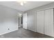 Bedroom with neutral walls, carpet, ceiling fan, a connected bathroom, and ample closet space at 4718 Dancer Dr, Indianapolis, IN 46237
