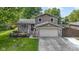 Charming two-story home with brick accents, well-maintained lawn, and attached two-car garage at 4718 Dancer Dr, Indianapolis, IN 46237