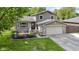 Charming two-story home with brick accents, well-maintained lawn, and attached two-car garage at 4718 Dancer Dr, Indianapolis, IN 46237