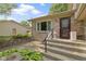Charming brick home with a welcoming front entrance featuring steps and wrought iron railings at 4718 Dancer Dr, Indianapolis, IN 46237