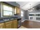 Kitchen features stainless steel appliances, a double sink, and dark countertops at 4718 Dancer Dr, Indianapolis, IN 46237