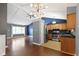 Open-concept living space with kitchen, dining area, and hardwood floors at 4718 Dancer Dr, Indianapolis, IN 46237